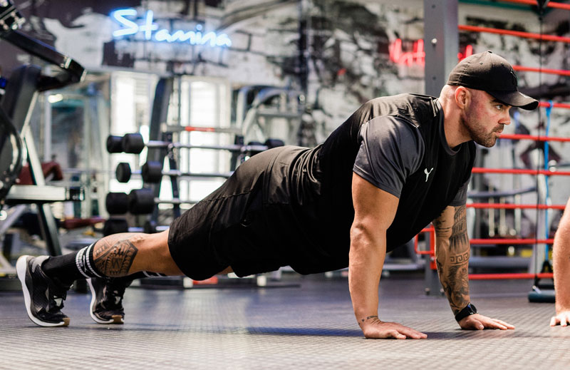 A photo of the coach performing a pushup.